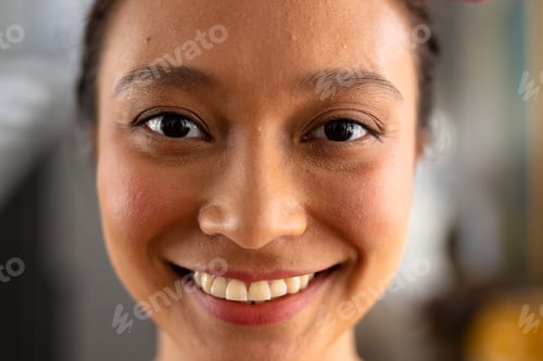 Preview: Portrait of happy asian woman with tied hair at home