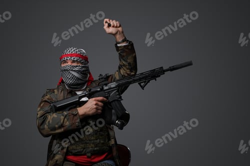 Preview: Person with Mask, Camouflage, and a Raised Fist