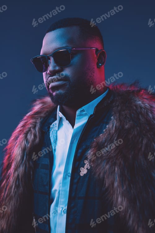 Vista previa: African businessman dressed in fur coat and suit