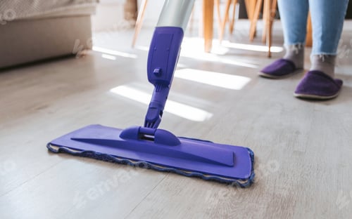 Preview: Close-up cropped image of floor mop, person cleaning floor, spring cleaning.