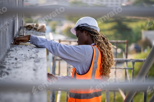 Preview: Engineer inspect building structure technicians looking at analyzing unfinished construction project
