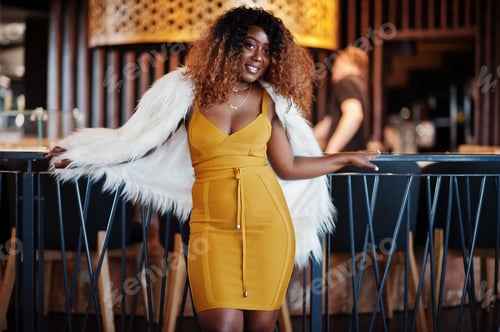 Preview: African american woman in yellow dress