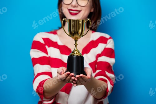 Preview: young smiling woman with cup trophy