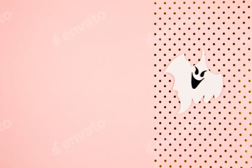 Preview: Top view of Halloween decoration with ghosts over pink backgroung. Party, invitation, halloween
