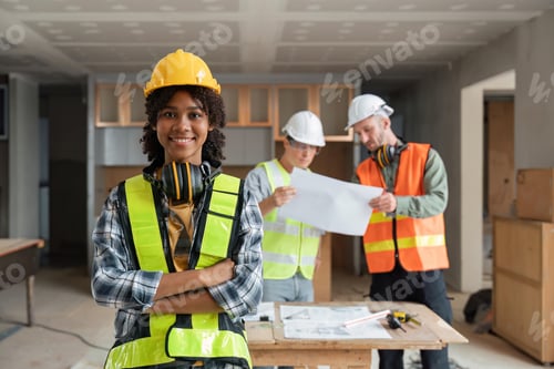 Preview: portrait female engineer project manager with construction gear and project blueprint Architecture