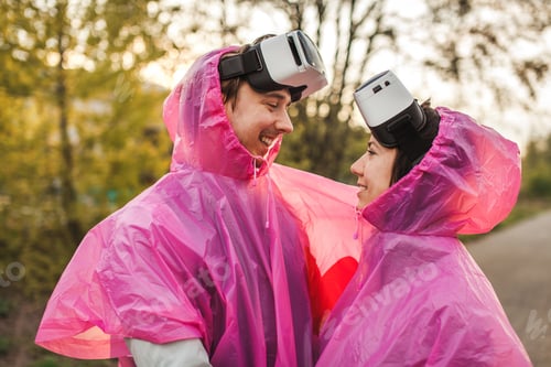 Preview: A male and a female romantically looking at each other with VR headsets taken off
