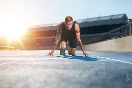Preview: Athlete in starting position ready to start a race