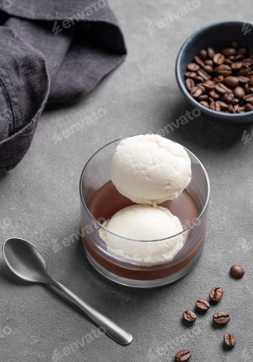 Preview: Affogato coffee with vanilla ice cream scoops and espresso in a glass on a dark background