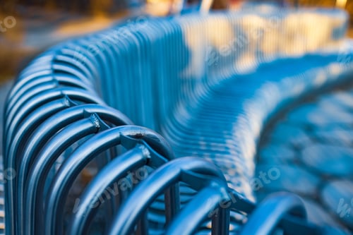 Preview: Close-up street bench metal pipes arranged parallel
