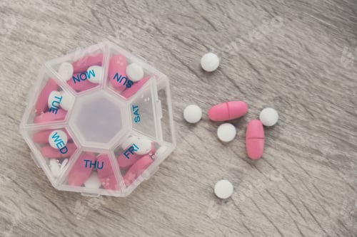 Preview: Organizer weekly shots Closeup of medical pill box with doses of tablets for daily take medicine