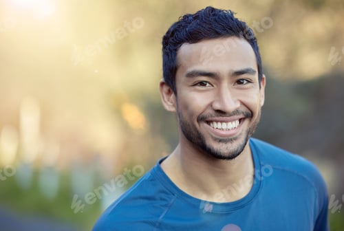 Preview: Shot of a handsome young man standing alone during his outdoor workout