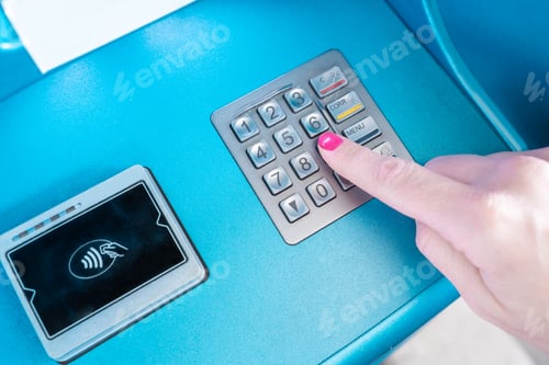 Preview: A womans finger is pressing a button on a communication device