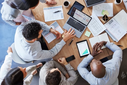 Preview: Shot of a group of unrecognizable businesspeople working together to meet their deadline at work