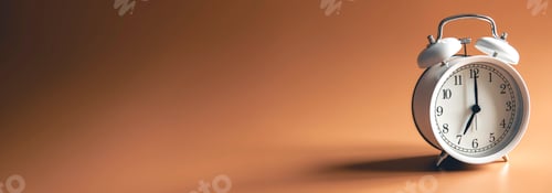 Preview: White alarm clock on brown background isolated.