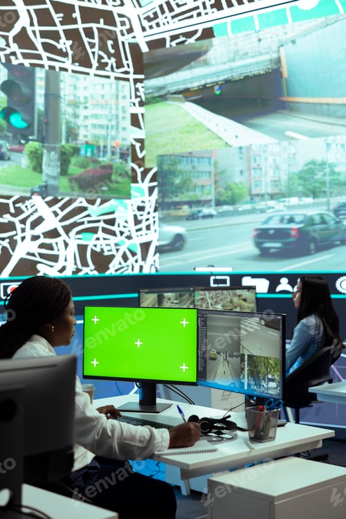 Preview: African american woman operator monitoring couriers in traffic via CCTV footage