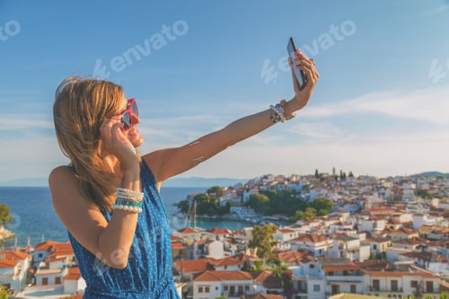 Preview: Girl Holding A Cellphone With Sea/Ocean Background.