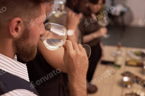 Preview: Man Smelling Chilled White Wine