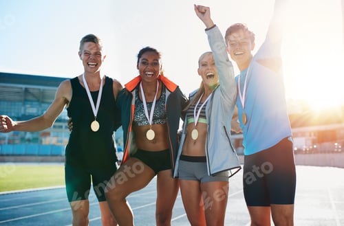 Preview: Excited group of runners with medals