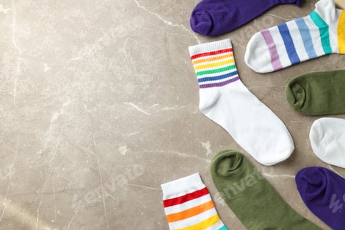 Preview: Different color socks on gray textured background