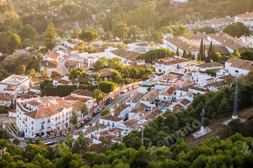 Preview: Beautiful aerial view of streets and house in Mijas Pueblo, a Spanish village at sunset