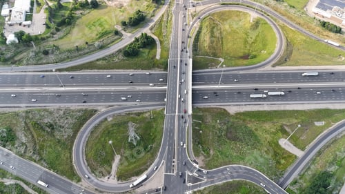 Preview: Aerial of a highway interchange with multiple lanes and green spaces in Waterloo, Ontario, Canada
