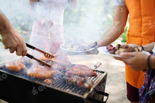 Preview: Delicious sausages on the barbecue grill outdoor