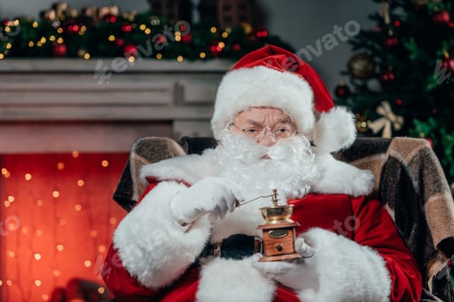 Preview: bearded santa claus in traditional red costume holding coffee grinder