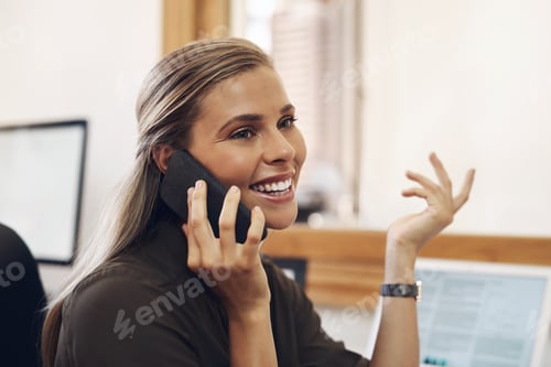 Preview: Pursuing big things in business. Shot of a young businesswoman talking on a cellphone in an office.