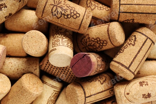 Preview: Many corks of wine bottles with grape images as background, top view