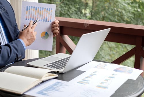 Preview: work from home, The hand of the businessman who works in finance at home and calculates financial