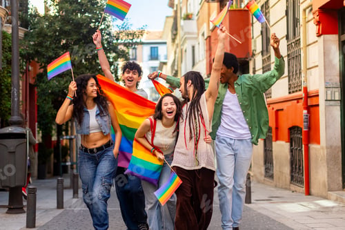 Preview: Young activists celebrating with rainbow flags at pride parade