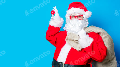 Preview: Funny Santa Claus have a fun with light bulb