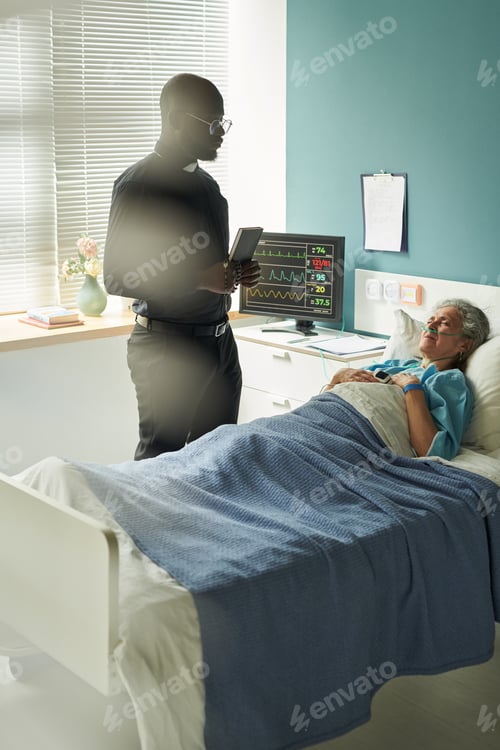 Preview: Chaplain with Bible Standing Beside Geriatric Female Patient in Hospice