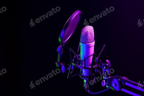 Preview: Professional microphone against black background in studio
