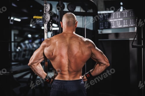 Preview: Fitness Man Showing His Muscles At The Gym