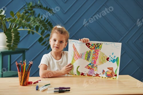 Preview: Cute little girl in art school shows her first paintings drawn by pencils and markers