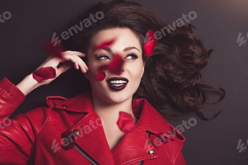Preview: top view of smiling girl with falling roses petals, valentines day concept