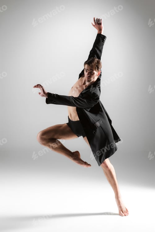 Preview: The young attractive modern ballet dancer on white background