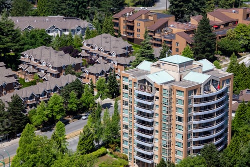 Preview: Aerial view of a residential homes in the suburbs during a sunny summer day