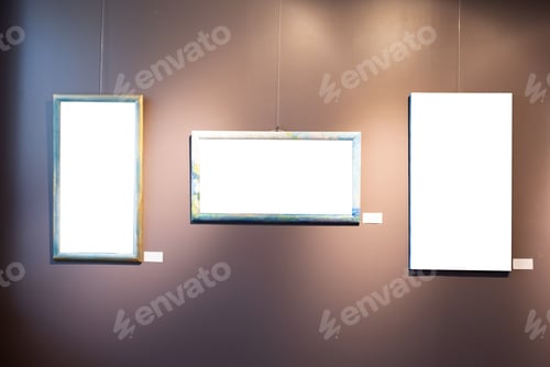Preview: Blank picture frames on brown wall with glowing lamp, mock up