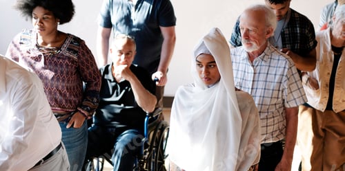 Preview: Diverse people queuing at a polling place