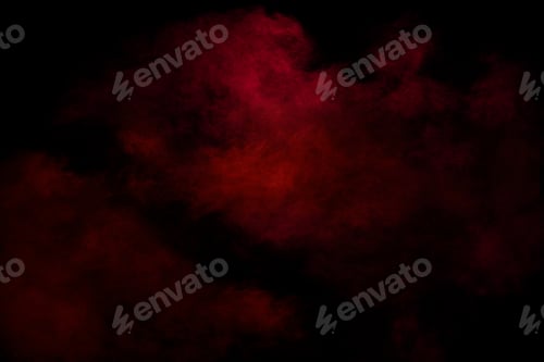 Preview: Red powder explosion cloud on black background. Freeze motion of red color dust .