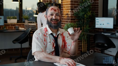 Preview: Nightmare zombie with bloody wounds smirking creepy while biting plant and waving at camera.