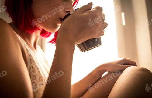 Preview: Woman drinking coffee in the morning