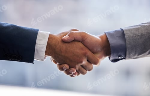 Preview: Cropped shot of two unrecognizable businesspeople standing together and shaking hands in the office