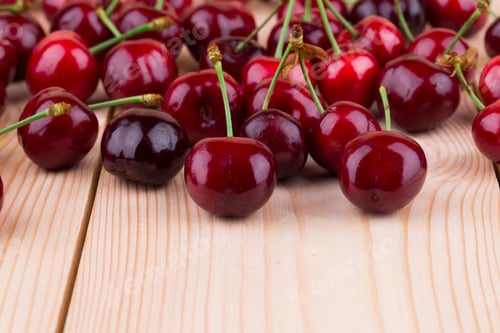 Preview: Fresh cherries on wooden table in the closeup.