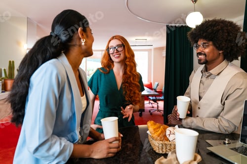 Preview: Multiethnic small group of businesspeople meeting in a coworking company office