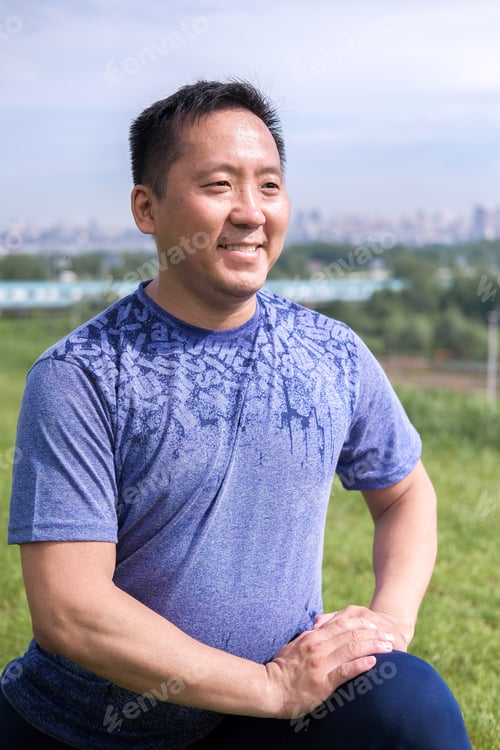 Preview: Korean Man Stretches Against The Background Of The City. Healthy Lifestyle. Adult Man Practicing