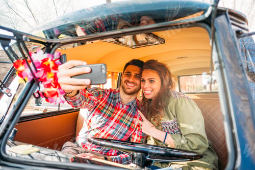 Preview: Woman and man enjoy in classic van.