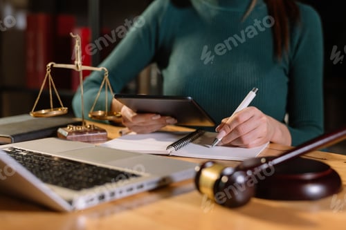 Preview: Justice and law concept.Male judge in a courtroom with the gavel, working